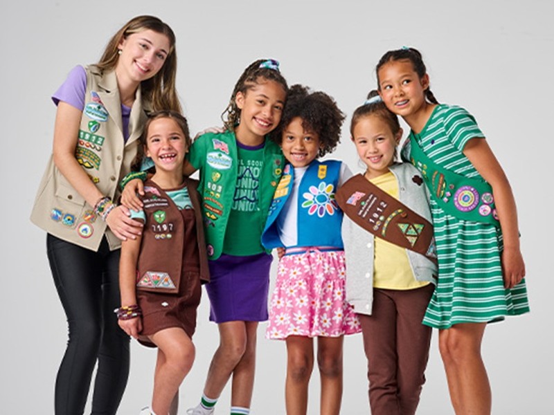 A group of Girl Scouts at all levels