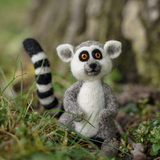 needle felted lemur by a tree